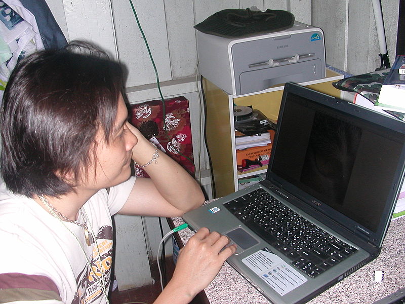 Thai guy using a Acer Travelmate