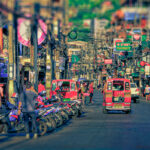 Tourists walking along a street in Patong, Phuket.