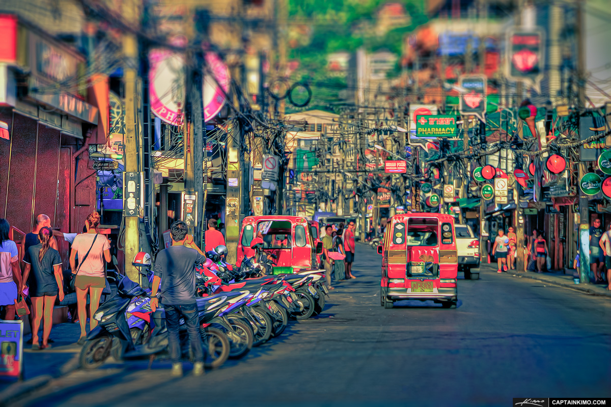 Tourists walking along a street in Patong, Phuket.