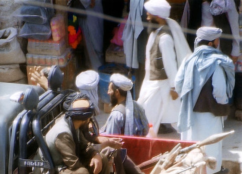 Taliban police in a pickup truck patrolling a street in Herat, Afghanistan