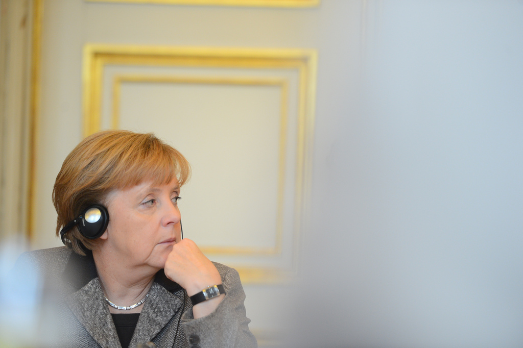 German chancellor Angela Merkel wearing headphones