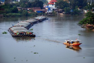 Barge and tugboat on the Pa Sak River in Ayutthaya