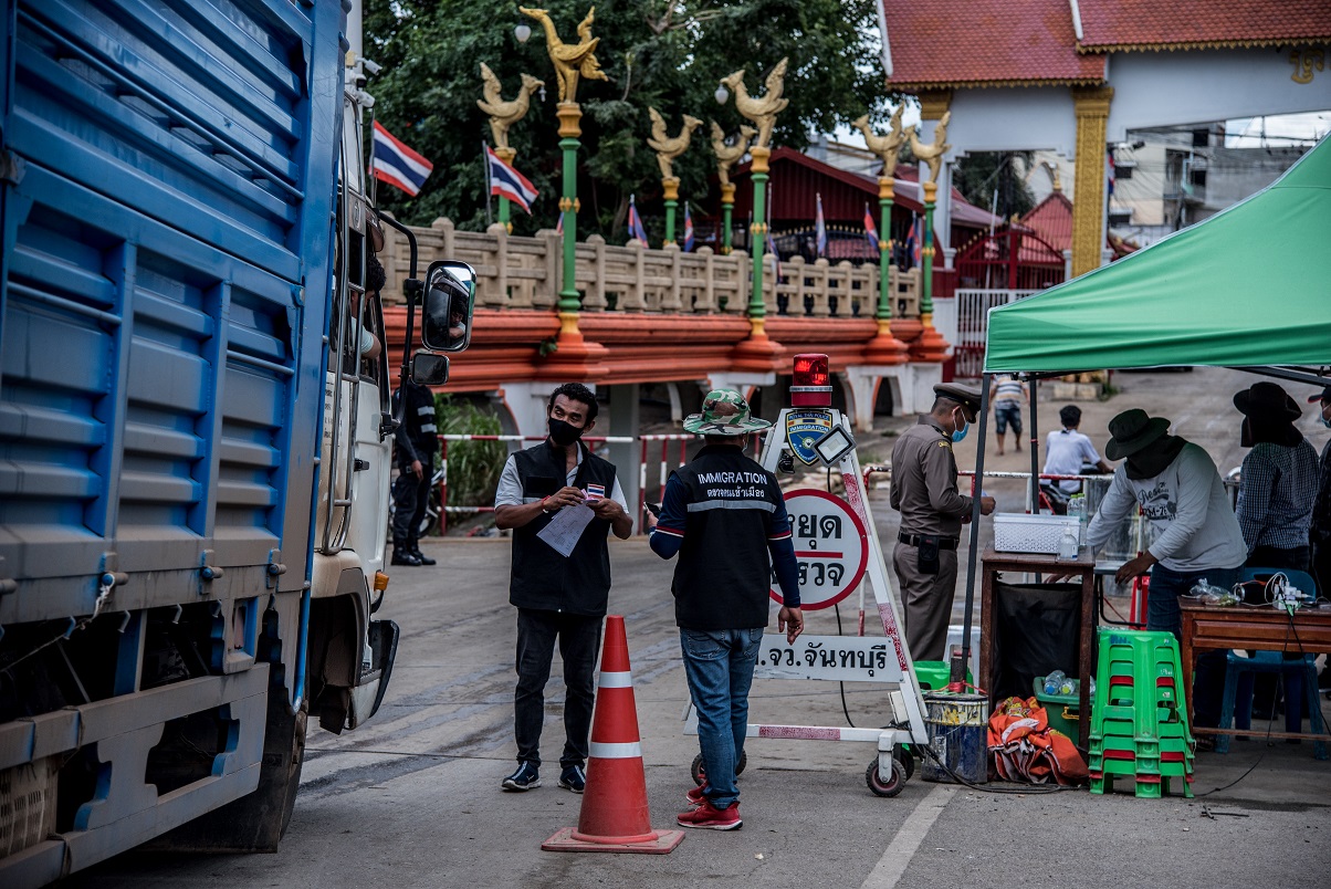 Immigration officer and volunteer at Baan Laem Police Checkpoint, Chanthaburi Province