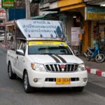 A white Toyota Hilux songthaew (baht bus) on 2nd Road, Pattaya