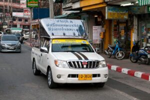 A white Toyota Hilux songthaew (baht bus) on 2nd Road, Pattaya
