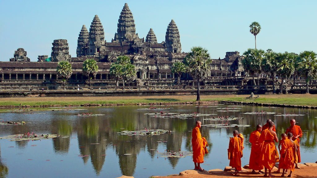 Buddhist monks in front of Angkor Wat temple