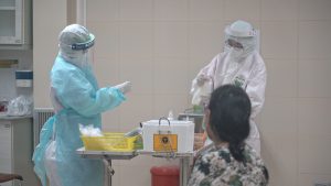 Healthcare workers performing COVID-19 coronavirus tests