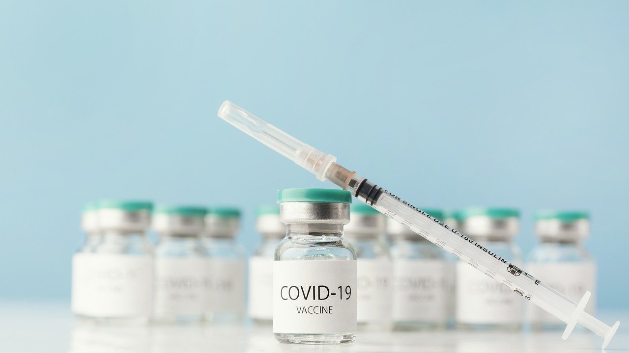 COVID-19 vaccine vials and syringe