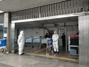 Medical check-up at Jishuitan Subway Station in Beijing due to COVID-19 threat. The workers, dressed in white, take the temperature to anyone who wants to access the metro