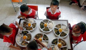 Children from a school in Korat eating