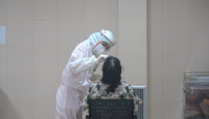 Healthcare worker performing a COVID-19 test at Thailand Bamrasnaradura Infectious Disease Institute, Ministry of Public Health, Nonthaburi