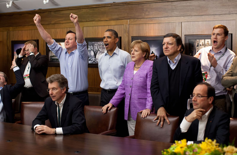 Prime Minister David Cameron of the United Kingdom, President Barack Obama, Chancellor Angela Merkel of Germany, José Manuel Barroso, President of the European Commission, and others watch the overtime shootout of the Chelsea vs. Bayern Munich Champions League final in the Laurel Cabin conference room