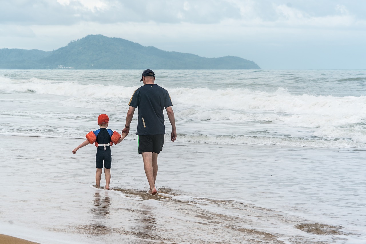 Father and son on Phuket beach