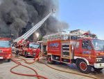 Several fire engines extinguishing a fire in Thailand.
