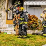 Firefighters after extinguish a fire in a house
