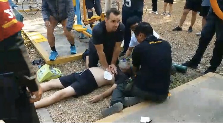 Foreigner performing a life saving CPR at Lumpini Park in Bangkok
