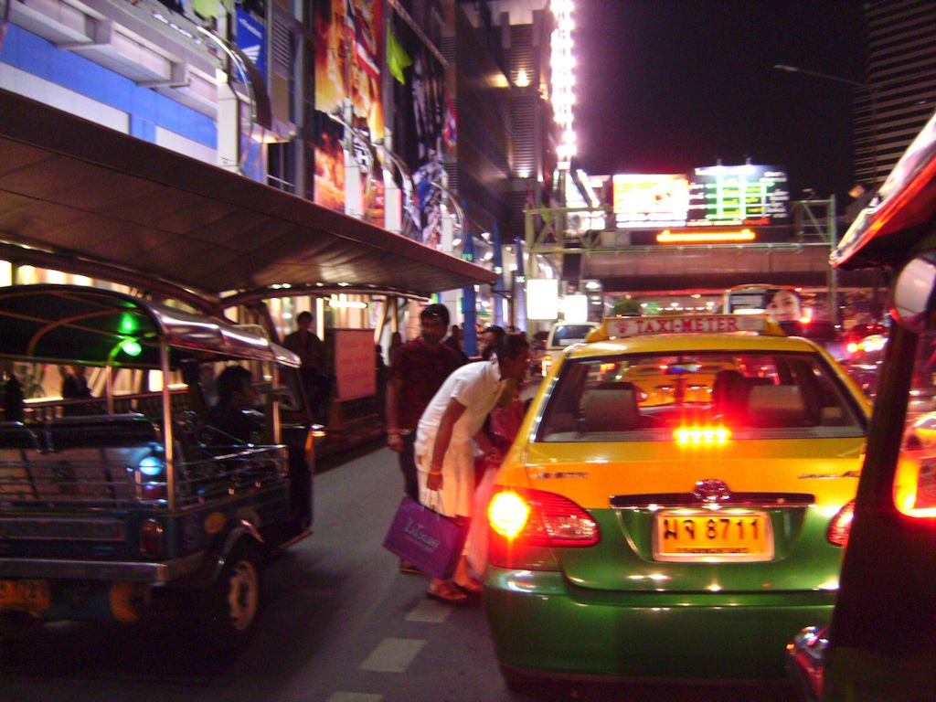 Foreigners taking a taxi in Bangkok