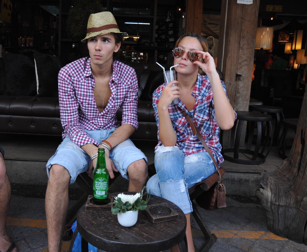 Foreign couple sitting down in Bangkok