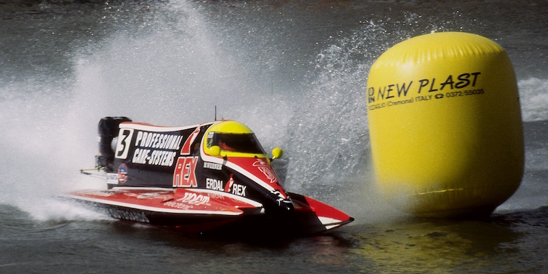 An F1 powerboat rounding a buoy