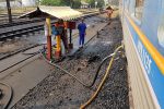 Fueling diesel locomotive at Nakhon Ratchasima train station.