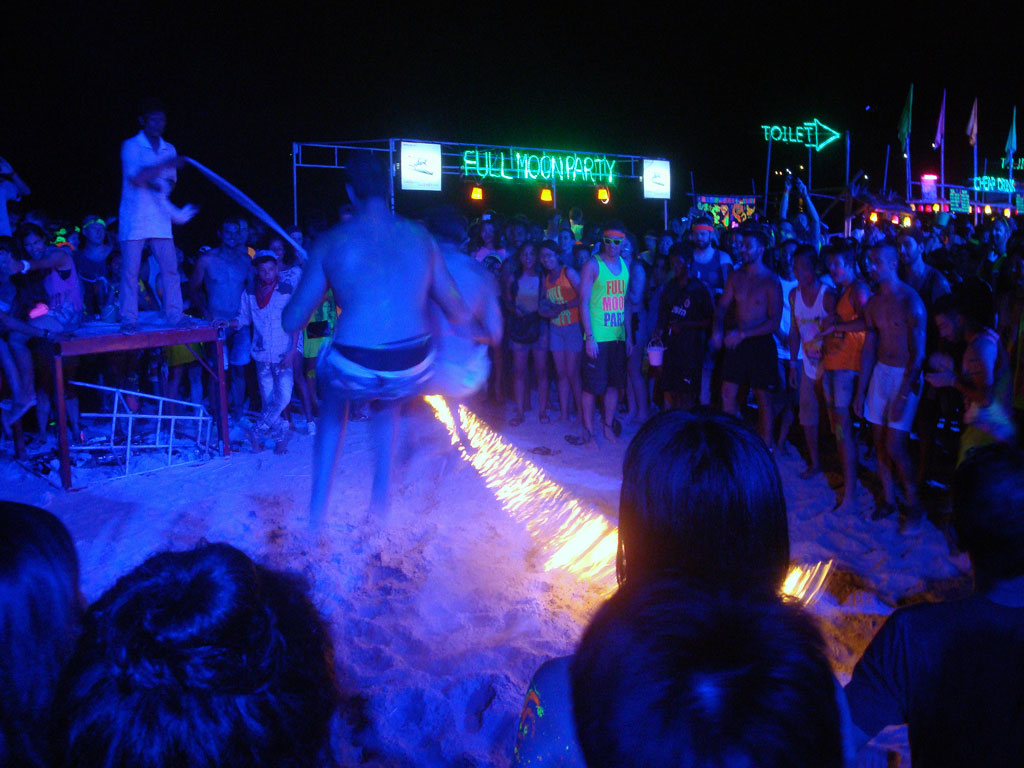 Playing fire skipping rope at Full Moon Party, Haad Rin Sunrise Beach in Koh Phangan
