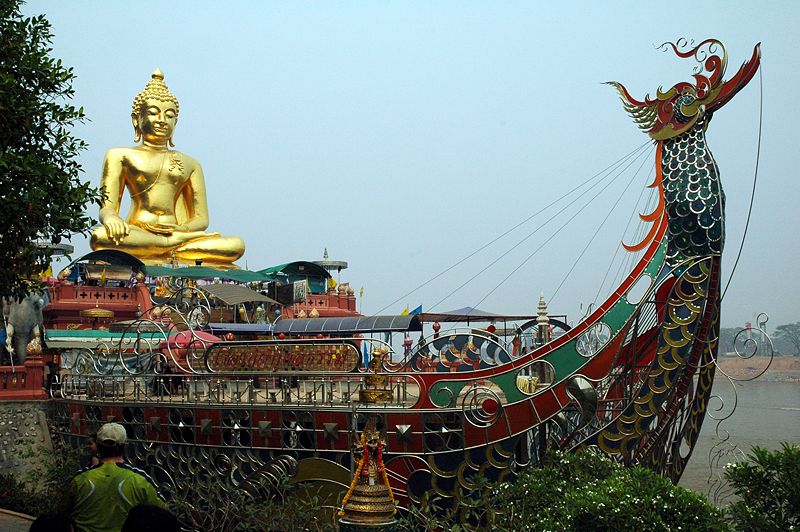Giant Buddha behind a treasure ship in the Golden Triangle