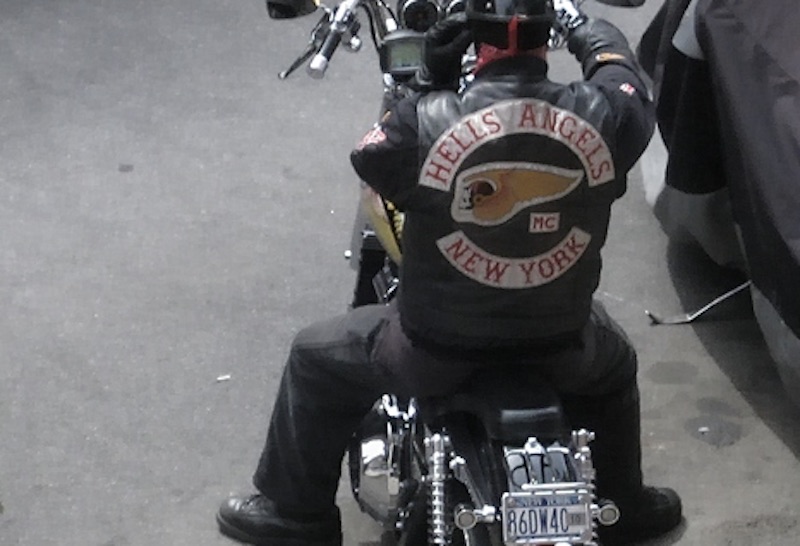 A member of the The Hells Angels Motorcycle Club (HAMC), whose members typically ride Harley-Davidson motorbikes