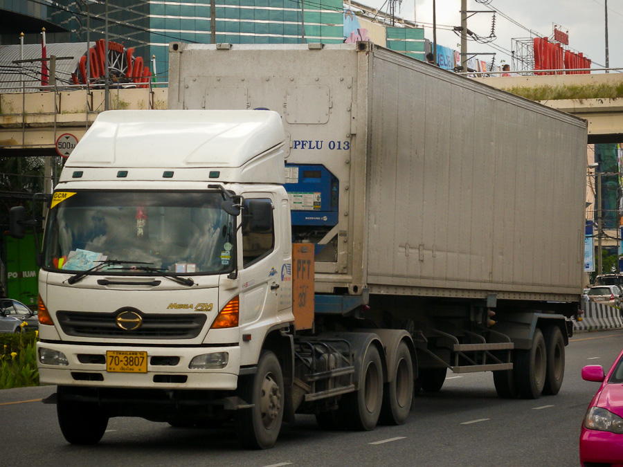 Hino truck draws a refrigerated container past Secon Square in Bangkok.