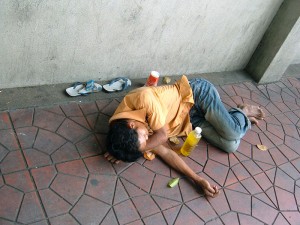 Homeless man sleeping in Bangkok