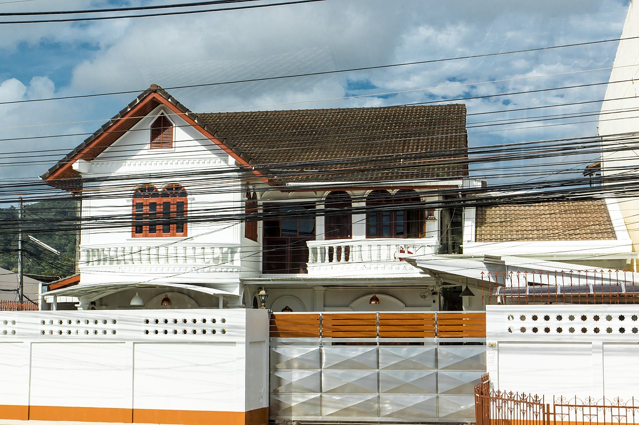 House and electrical wires located on a street in Wichit, Phuket