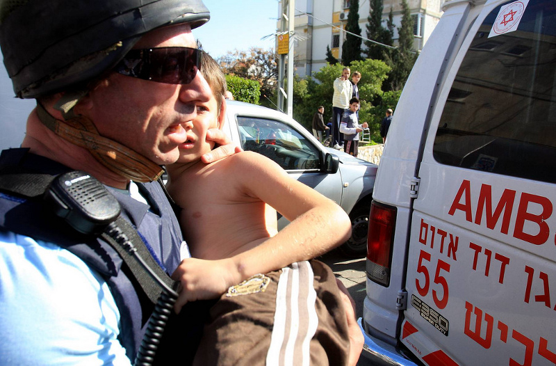 A wounded Israeli Child is taken to hospital after Rocket Attack