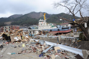A tug boat is among debris in Ofunato, Japan