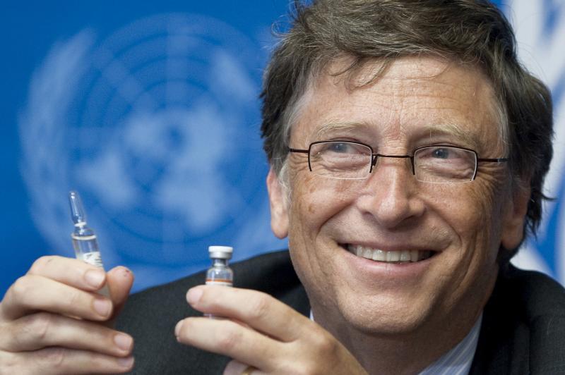 Bill Gates, Co-Chair the Bill & Melinda Gates Foundation shows a vaccine during the press conference
