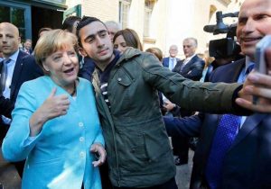 Angela Merkel selfie with Syrian refugee