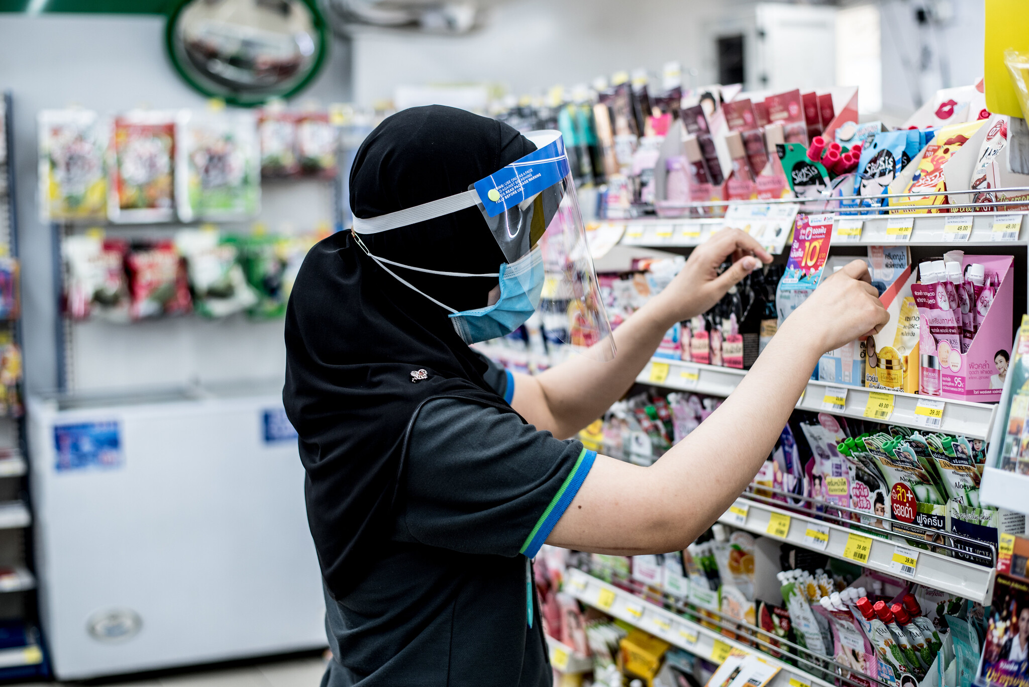 Mini Mart clerk during the COVID-19 pandemic in Thailand