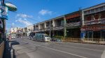 Minivans and motorcycles on Ratsada Road, Phuket.