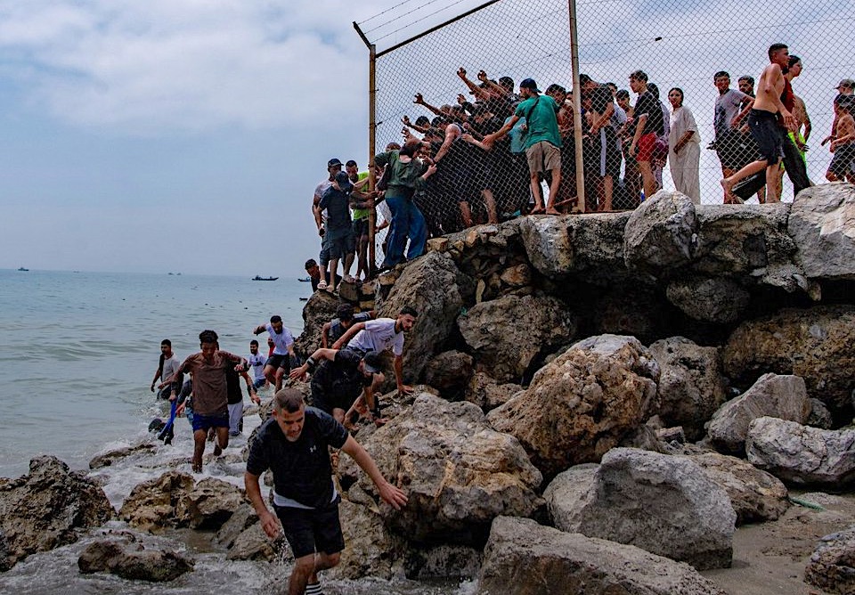 Mass migrant crossing overwhelms authorities in Spain's Ceuta.