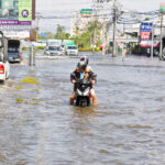 Motorbike on a flooded street in Thailand