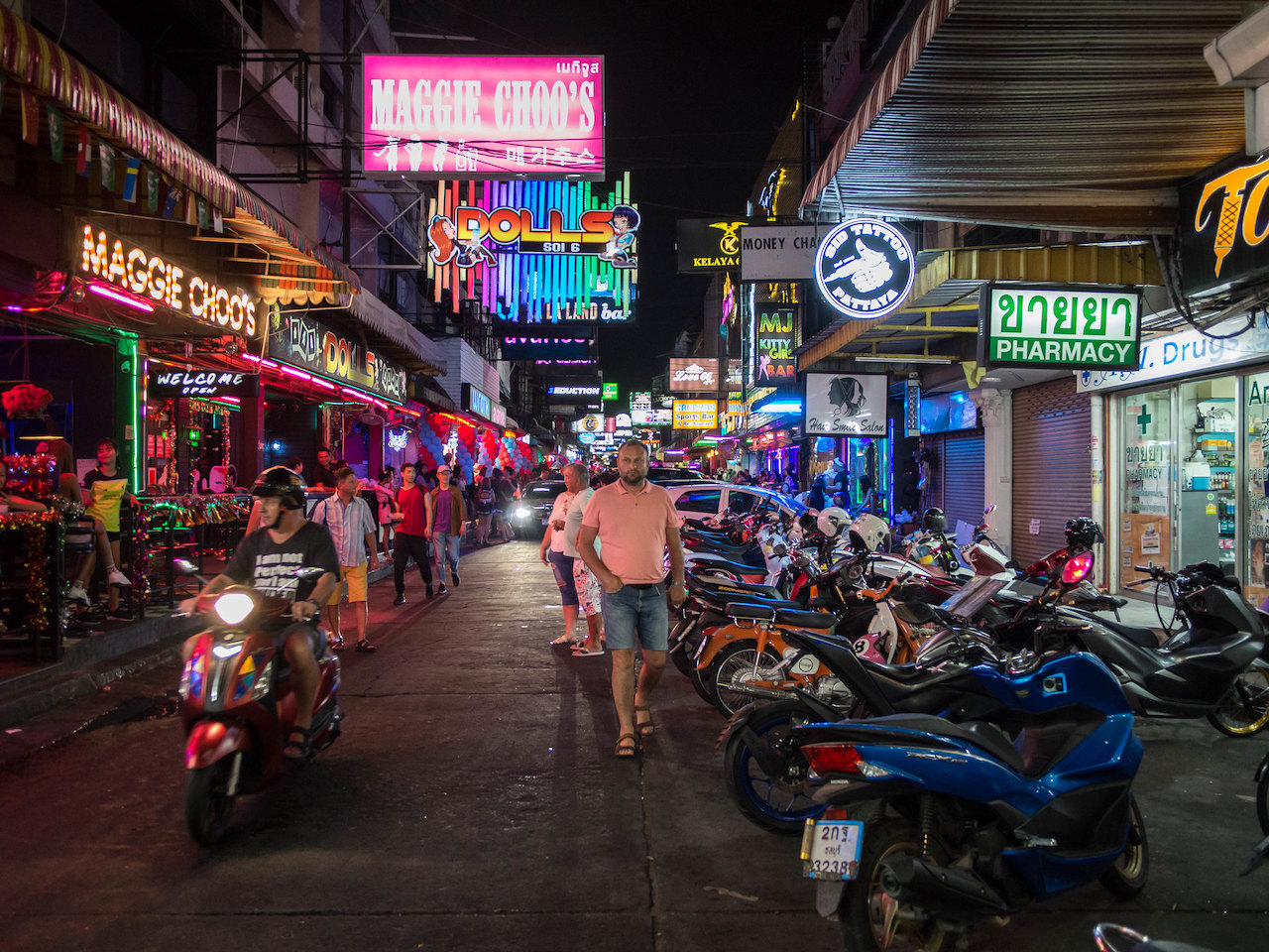 Motorcycles parked on a Pattaya street around midnight