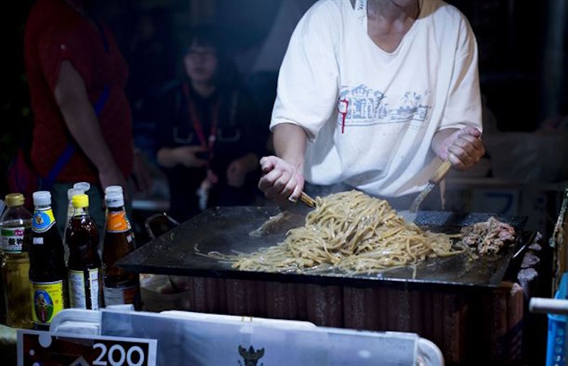 Street vendor cooking noodles