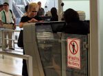 Passport check at immigration, Suvarnabhumi Airport in Bangkok. (censored)