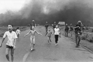 9-year-old Phan Thị Kim Phúc (center) and other children running down Route 1 near Trảng Bàng in Vietnam, after a South Vietnamese plane accidentally dropped napalm on South Vietnamese troops and civilians on June 8, 1972