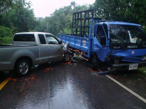 Pickup and blue truck crash