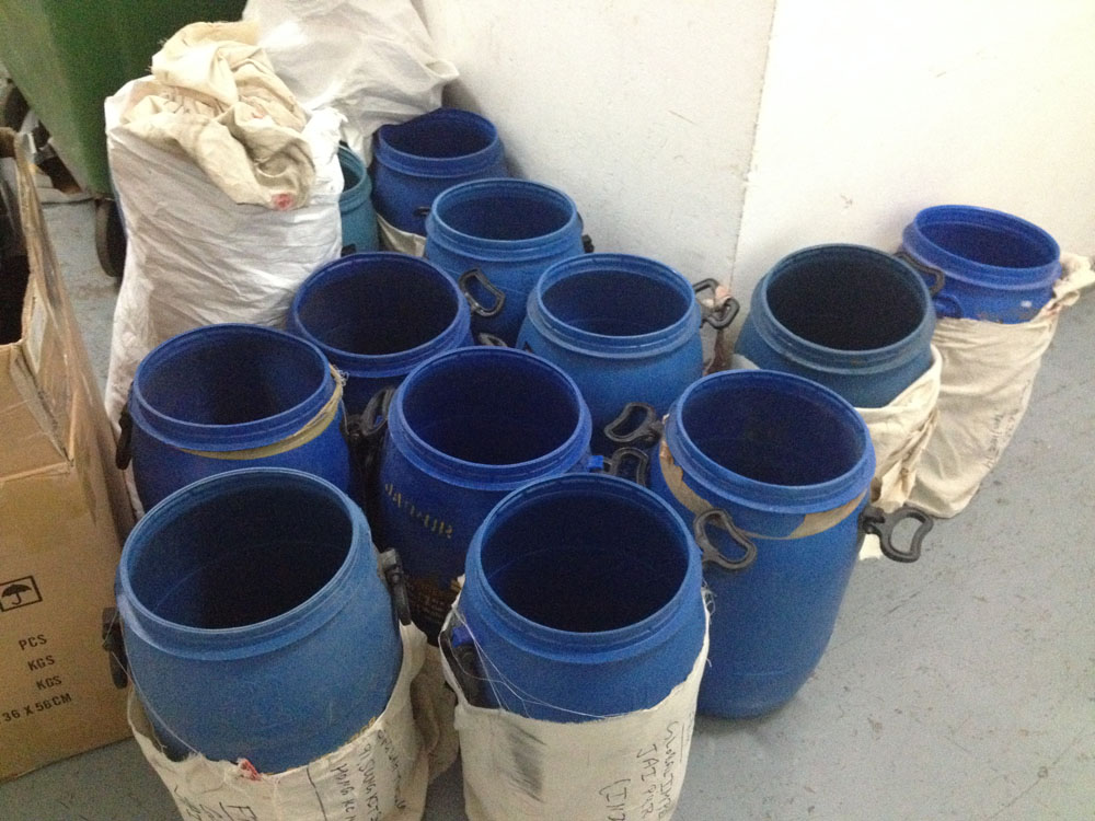 Blue plastic barrels.