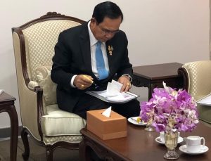 Prime Minister of Thailand Prayut Chan-o-cha examining documents