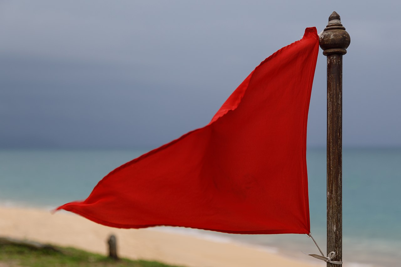Red flag warning at Mai Khao Beach in Phuket.