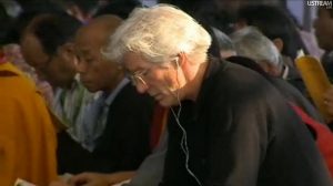 Richard Gere listening to the English translation of His Holiness the 14th Dalai Lama's teaching