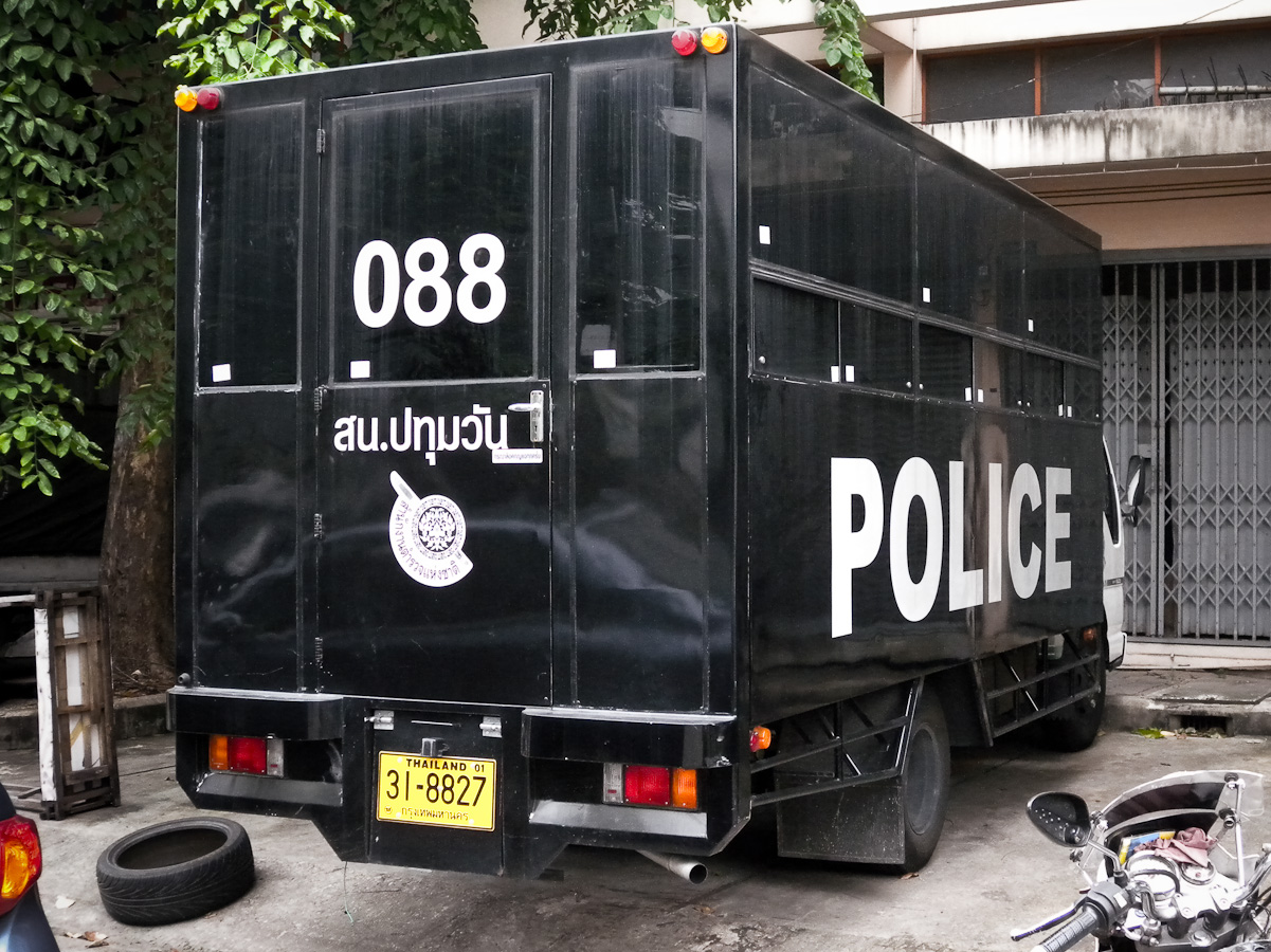 Thai Prisoner Police Truck with a bus license plate