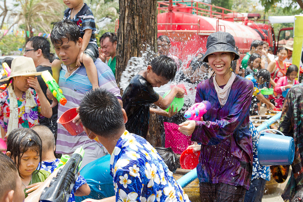 Beautiful girl splashing water at Songkran festival in Ayuttaya