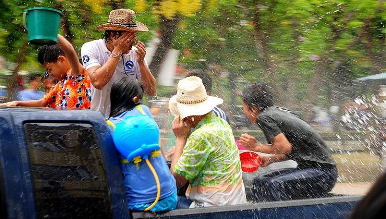 People on the back of a truck during the Songkran festival in Chiang Mai